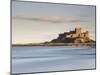 Bamburgh Castle Bathed in Golden Evening Light Overlooking Bamburgh Bay with the Sea Filling the Fo-Lee Frost-Mounted Photographic Print