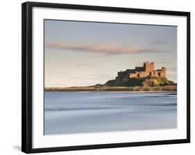 Bamburgh Castle Bathed in Golden Evening Light Overlooking Bamburgh Bay with the Sea Filling the Fo-Lee Frost-Framed Photographic Print