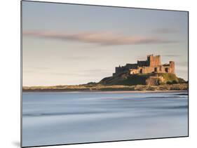 Bamburgh Castle Bathed in Golden Evening Light Overlooking Bamburgh Bay with the Sea Filling the Fo-Lee Frost-Mounted Photographic Print