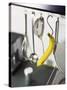 Banana and Kitchen Tools Hanging on Hooks in Kitchen-Kröger & Gross-Stretched Canvas