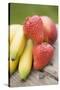 Bananas, Strawberries and Nectarine on Wooden Table-Foodcollection-Stretched Canvas