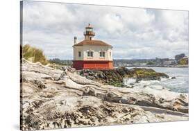 Bandon, Oregon, USA. Beach logs and the Coquille River Lighthouse on the Oregon coast.-Emily Wilson-Stretched Canvas