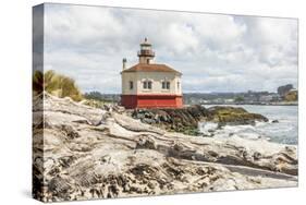 Bandon, Oregon, USA. Beach logs and the Coquille River Lighthouse on the Oregon coast.-Emily Wilson-Stretched Canvas