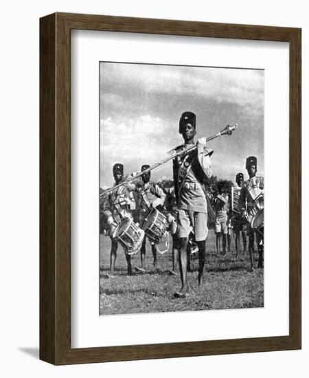 Bandsmen of the Northern Rhodesia Regiment Beat a Military Tattoo, Zimbabwe, Africa, 1936-null-Framed Giclee Print