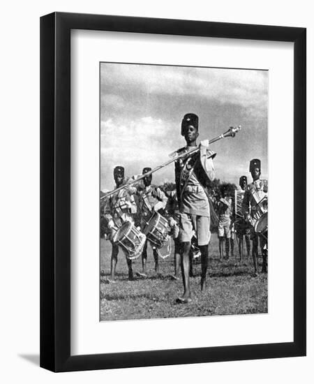 Bandsmen of the Northern Rhodesia Regiment Beat a Military Tattoo, Zimbabwe, Africa, 1936-null-Framed Giclee Print