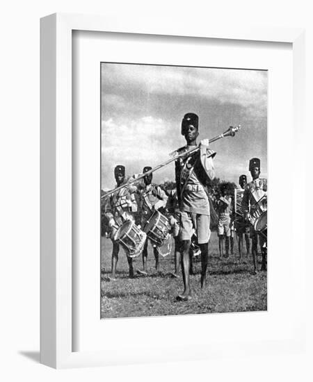 Bandsmen of the Northern Rhodesia Regiment Beat a Military Tattoo, Zimbabwe, Africa, 1936-null-Framed Giclee Print