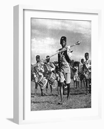 Bandsmen of the Northern Rhodesia Regiment Beat a Military Tattoo, Zimbabwe, Africa, 1936-null-Framed Giclee Print