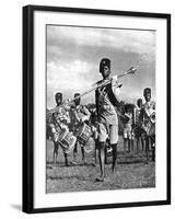 Bandsmen of the Northern Rhodesia Regiment Beat a Military Tattoo, Zimbabwe, Africa, 1936-null-Framed Giclee Print