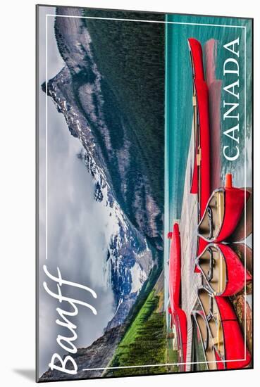 Banff, Canada - Lake Louise Canoes-Lantern Press-Mounted Art Print