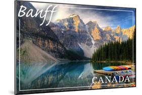 Banff, Canada - Moraine Lake Canoes-Lantern Press-Mounted Art Print