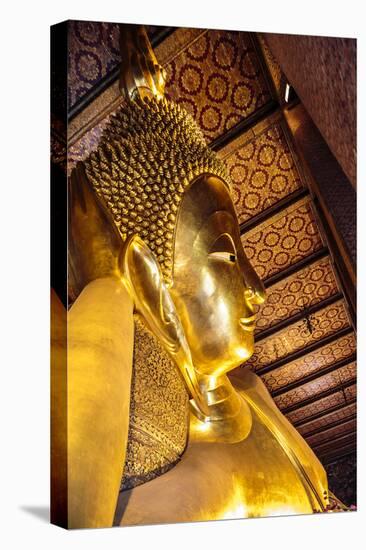 Bangkok, Thailand. Giant reclining gold Buddha statue at Wat Pho temple-Miva Stock-Stretched Canvas