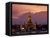 Bangkok, Thailand; the Wat Arun Temple across the Chao Phraya River at Sunset-Dan Bannister-Framed Stretched Canvas