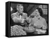 Barbara Angle Helping Her Husband Samuel Angle Prepare Food for the Flying Squirrels-Bernard Hoffman-Framed Stretched Canvas