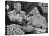 Barbara Angle Helping Her Husband Samuel Angle Prepare Food for the Flying Squirrels-Bernard Hoffman-Stretched Canvas