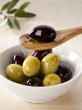 Green and Black Olives in Small Dish and on Wooden Spoon-Barbara Kraske-Laminated Photographic Print