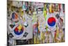 Barbed wire fence separates South from North Korea - South Korean flags and prayer wishes attach...-null-Mounted Photographic Print