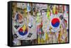 Barbed wire fence separates South from North Korea - South Korean flags and prayer wishes attach...-null-Framed Stretched Canvas