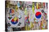 Barbed wire fence separates South from North Korea - South Korean flags and prayer wishes attach...-null-Stretched Canvas