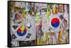 Barbed wire fence separates South from North Korea - South Korean flags and prayer wishes attach...-null-Framed Stretched Canvas