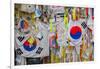 Barbed wire fence separates South from North Korea - South Korean flags and prayer wishes attach...-null-Framed Photographic Print