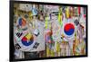 Barbed wire fence separates South from North Korea - South Korean flags and prayer wishes attach...-null-Framed Photographic Print