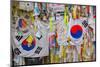 Barbed wire fence separates South from North Korea - South Korean flags and prayer wishes attach...-null-Mounted Photographic Print