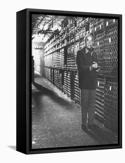 Baron Philippe De Rothschild in a Wine Cellar at Chateau Mouton Rothschild-Carlo Bavagnoli-Framed Stretched Canvas