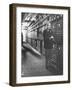 Baron Philippe De Rothschild in a Wine Cellar at Chateau Mouton Rothschild-Carlo Bavagnoli-Framed Photographic Print