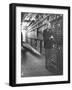 Baron Philippe De Rothschild in a Wine Cellar at Chateau Mouton Rothschild-Carlo Bavagnoli-Framed Photographic Print