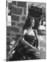 Baroness Fiona Thyssen-Bornemisza Sun-Bathing Wrapped in a Fur Rug at Resort-Leonard Mccombe-Mounted Premium Photographic Print