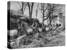 Barrels Being Rolled on Wooden Rails at Jack Daniels Distillery-Ed Clark-Stretched Canvas