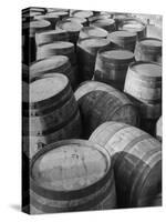 Barrels Sitting in Warehouse at Jack Daniels Distillery-Ed Clark-Stretched Canvas