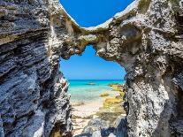 Blue and turquoise Sargasso Sea, glimpsed through an arch in the island's distinctive rocks-Barry Davis-Photographic Print