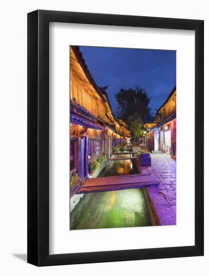 Bars and restaurants along canal at dusk, Lijiang, UNESCO World Heritage Site, Yunnan, China, Asia-Ian Trower-Framed Photographic Print