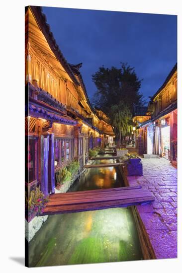 Bars and restaurants along canal at dusk, Lijiang, UNESCO World Heritage Site, Yunnan, China, Asia-Ian Trower-Stretched Canvas