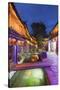 Bars and restaurants along canal at dusk, Lijiang, UNESCO World Heritage Site, Yunnan, China, Asia-Ian Trower-Stretched Canvas