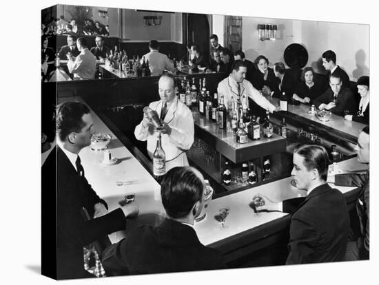 Bartender Prepares a Drink as Patrons Enjoy Themselves at Popular Speakeasy during Prohibition-Margaret Bourke-White-Stretched Canvas