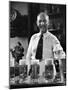 Bartender Smiling as He Serves Large Glasses of Beer-Frank Scherschel-Mounted Photographic Print
