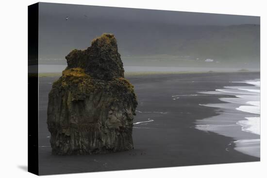 Basalt Column Rises from Black Sand Beach on Rainy Day, Vik, Iceland-Jaynes Gallery-Stretched Canvas