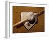 Baseball Bat with a Cap, and a Baseball on the Home Base-null-Framed Photographic Print