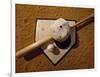 Baseball Bat with a Cap, and a Baseball on the Home Base-null-Framed Photographic Print