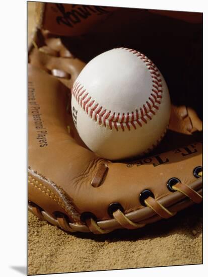 Baseball in a Glove-null-Mounted Photographic Print