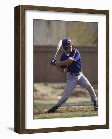 Baseball Player in Action Batting-null-Framed Photographic Print