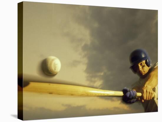 Baseball Player Swinging a Bat-null-Stretched Canvas