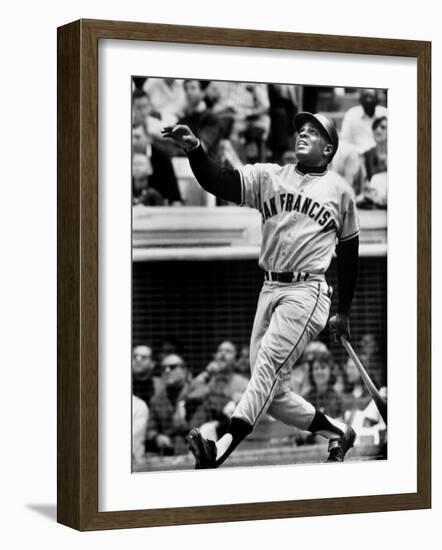 Baseball Player Willie Mays Watching Ball Clear Fence for Home Run in Game with Dodgers-Ralph Morse-Framed Premium Photographic Print