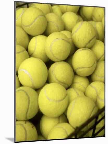 Basket of Tennis Balls-null-Mounted Photographic Print