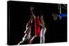 Basketball Game Sport Player in Action Isolated on Black Background-dotshock-Stretched Canvas