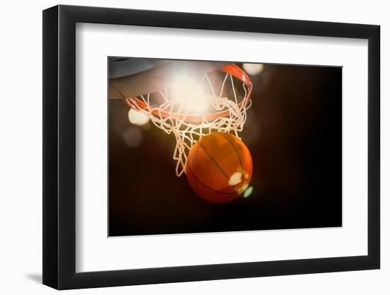 Basketball Going through the Basket at a Sports Arena (Intentional Spotlight)-yobro-Framed Photographic Print