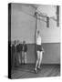 Basketball Player Max Palmer Reaching Up to Drop Basketball into Basket-null-Stretched Canvas