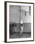 Basketball Player Max Palmer Reaching Up to Drop Basketball into Basket-null-Framed Photographic Print